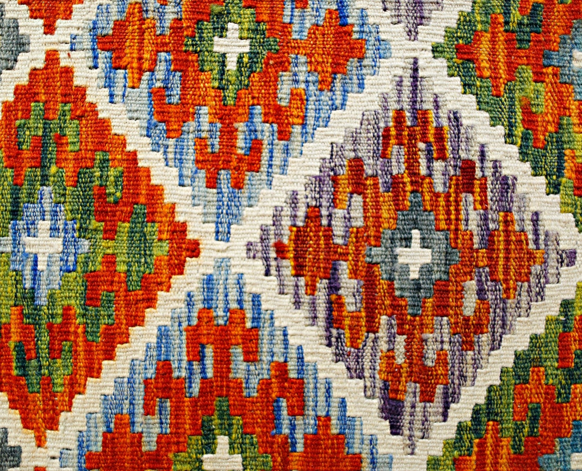 Handwoven Afghan Maimana kilim featuring a vibrant geometric diamond pattern in wool.