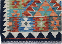 Handwoven Afghan Maimana kilim rug featuring a colorful geometric pattern and fringed edges.