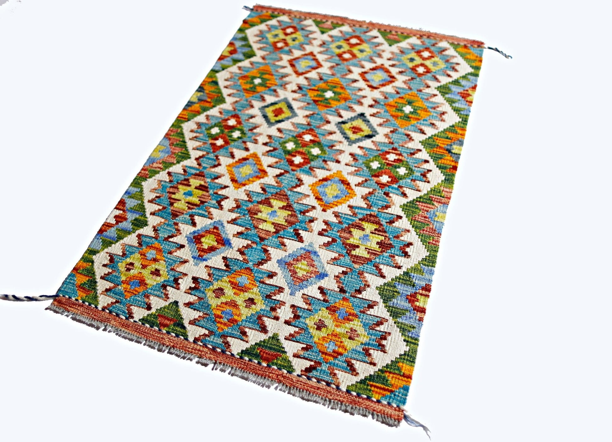 Handwoven Afghan Maimana kilim rug featuring a colorful geometric pattern on a cream background.