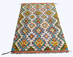 Handwoven Afghan Maimana kilim rug featuring a colorful geometric pattern in wool.
