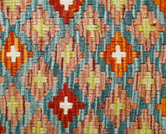 Handwoven Afghan Maimana kilim featuring a geometric pattern of colorful diamonds and crosses.