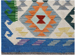 Handwoven Afghan Maimana kilim featuring a geometric diamond pattern in vibrant wool colors.