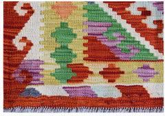 Handwoven Afghan Maimana kilim rug featuring a vibrant geometric pattern in wool.