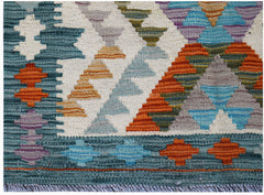 Handwoven Afghan Maimana kilim featuring a geometric pattern in vibrant multicolored wool.