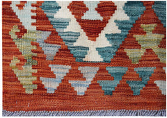 Handwoven Afghan Maimana kilim rug featuring a geometric pattern in rust, blue, and cream tones.