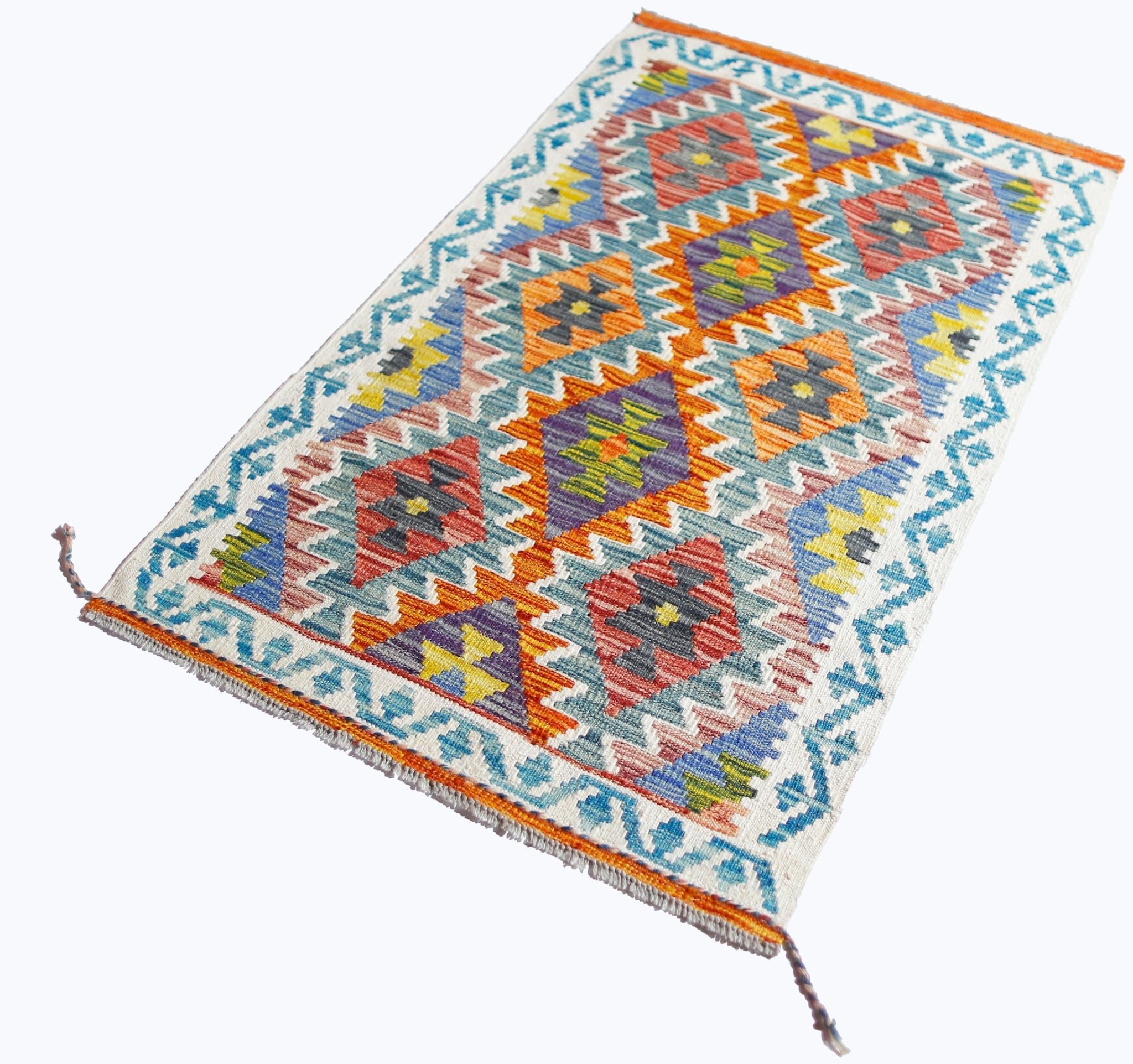 Handwoven Afghan Maimana kilim rug featuring a colorful geometric pattern and fringed edges.