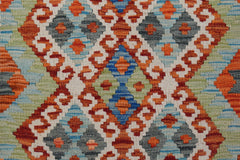 Handwoven Afghan Maimana kilim featuring a geometric pattern in orange, blue, green, and grey.