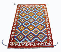 Handwoven Afghan Maimana wool kilim featuring a vibrant geometric diamond pattern.