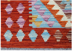 Handwoven Afghan Maimana kilim featuring geometric patterns in vibrant orange, blue, and purple.