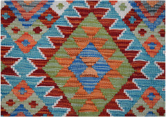Handwoven Afghan Maimana kilim rug featuring a vibrant geometric diamond pattern in wool.