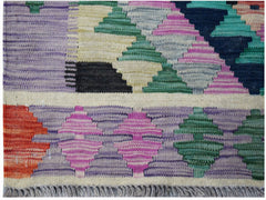 Handwoven Afghan Maimana kilim featuring a vibrant geometric pattern in wool.