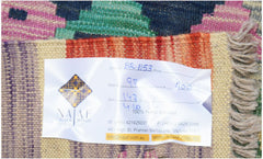 A handwoven Afghan Maimana Kilim featuring a vibrant geometric pattern in wool.