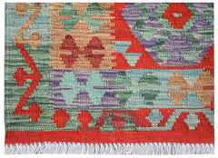 Afghan Maimana Kilim with geometric patterns in red, green, purple, and tan.