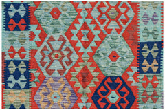 Handwoven Afghan Maimana kilim rug featuring a vibrant geometric pattern in red, blue, and green.