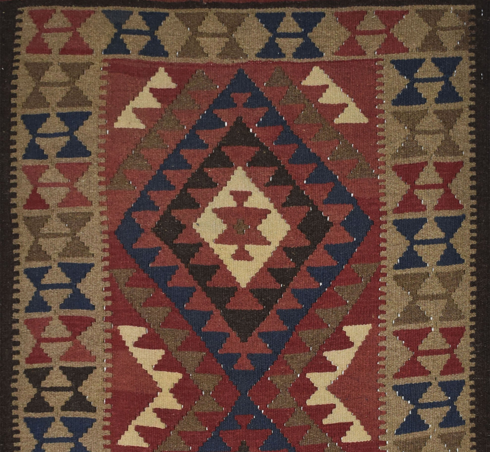 Handmade Afghan Maimana kilim rug featuring a geometric diamond pattern in red, blue, and tan.