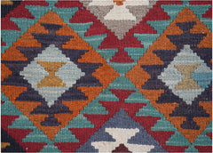 Handwoven Afghan Maimana kilim featuring a geometric diamond pattern in vibrant wool colors.