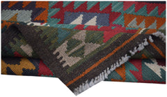 A handwoven Afghan Maimana kilim featuring a colorful geometric pattern and a flatweave texture.