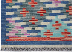 Handwoven Afghan Maimana kilim rug featuring a geometric pattern in blue, red, and cream tones.