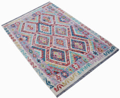 Handwoven Afghan Maimana kilim rug featuring a colorful geometric diamond pattern in wool.