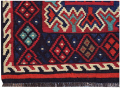 Handwoven Afghan Maimana kilim featuring a geometric pattern in red, blue, and cream wool.