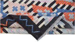 A handmade Afghan Maimana kilim rug featuring a geometric pattern in vibrant multicolored wool.