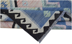 A handwoven Afghan Maimana kilim rug featuring a geometric pattern in blue, black, and cream.