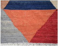 Handwoven Afghan Maimana kilim featuring a geometric pattern in blue, orange, red, and grey.