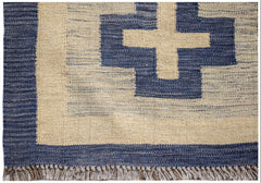 Handwoven Afghan Maimana kilim rug featuring a blue and cream geometric cross pattern.