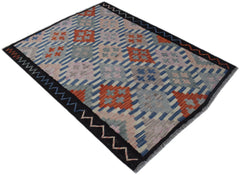 Handwoven Afghan Maimana kilim rug featuring a geometric pattern in orange, blue, and grey tones.
