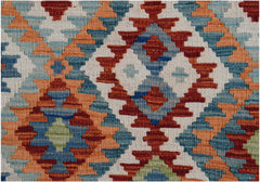 A handwoven Afghan Maimana kilim featuring a geometric pattern in red, blue, orange, and cream.