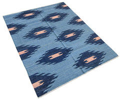 Handwoven Afghan Maimana kilim rug featuring a blue background with repeating dark diamond patterns.