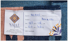 Afghan Maimana Kilim with geometric patterns and a handwritten tag.