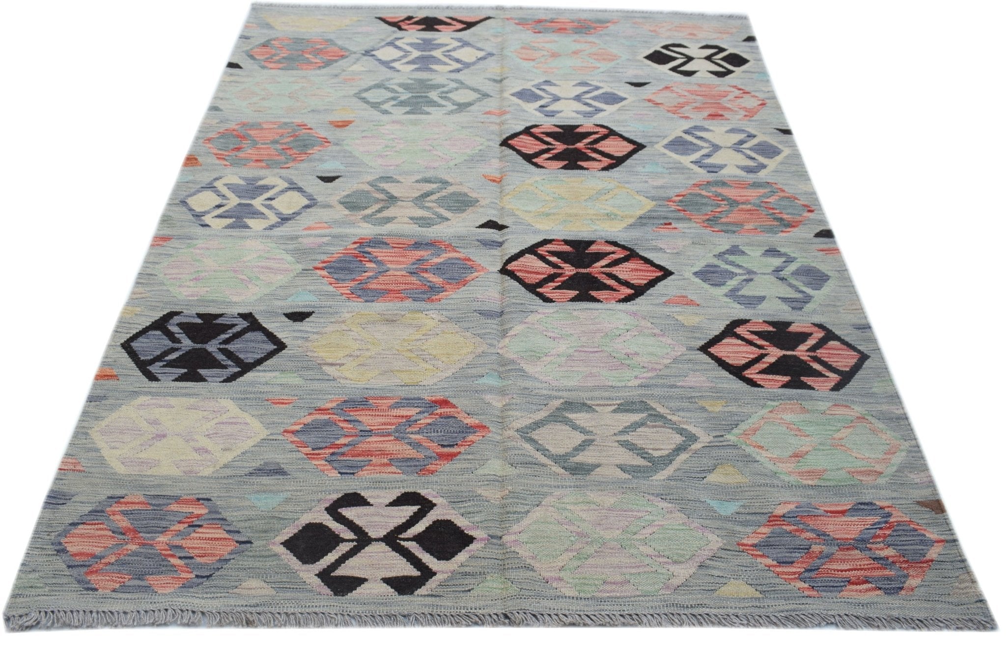 Handwoven Afghan Maimana kilim rug featuring a geometric pattern in multicolored wool.