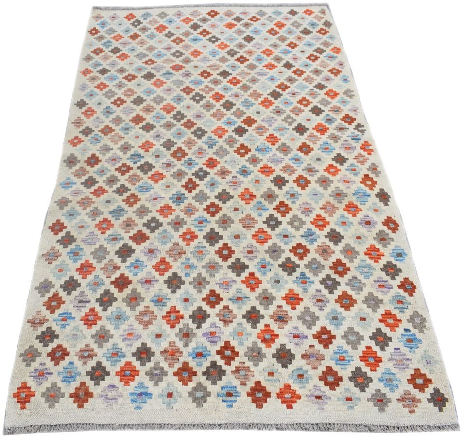 Handmade Afghan Maimana kilim rug featuring a repeating geometric pattern in red, blue, and grey.