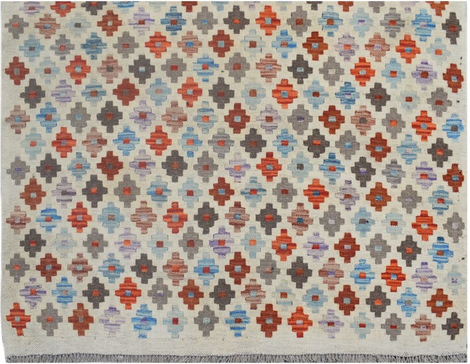 Handmade Afghan Maimana kilim rug featuring a repeating geometric pattern in vibrant colors.