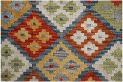 Handwoven Afghan Maimana kilim featuring a geometric diamond pattern in vibrant wool colors.