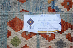 A handwoven Afghan Maimana kilim featuring a geometric pattern in orange, green, and blue tones.