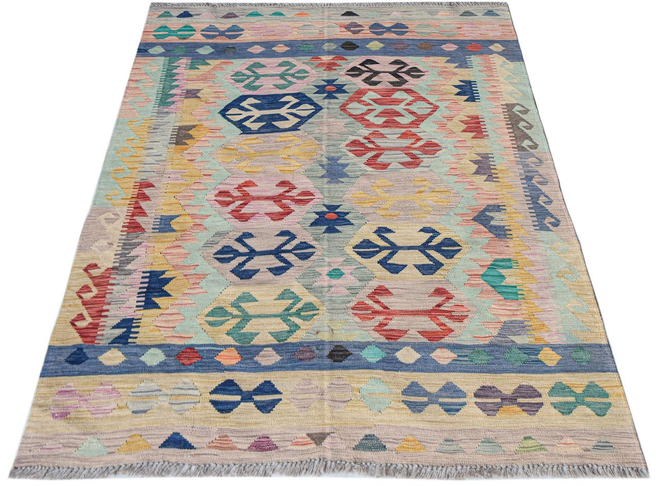 Handwoven Afghan Maimana kilim rug featuring a colorful geometric pattern on a flat wool weave.
