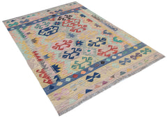 Handwoven Afghan Maimana kilim rug featuring a colorful geometric pattern on a flat wool weave.