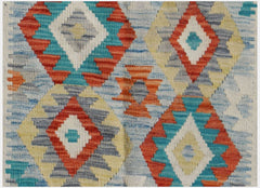 Handwoven Afghan Maimana kilim featuring a geometric diamond pattern in vibrant multicolored wool.