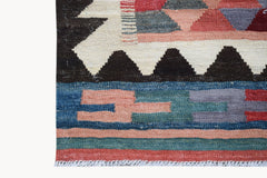 Handwoven Afghan Maimana kilim featuring geometric patterns in red, blue, and cream wool.