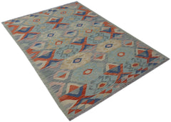 Handwoven Afghan Maimana kilim rug featuring a geometric pattern in blue, orange, and cream tones.