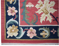 Handwoven Afghan Maimana kilim featuring a floral pattern in red, blue, and cream wool.