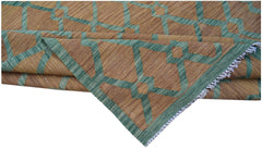 Handwoven Afghan Maimana kilim rug featuring a geometric pattern in green and brown wool.