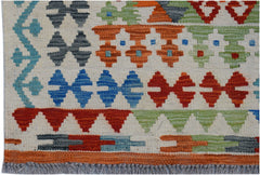 Handwoven Afghan Maimana kilim rug featuring geometric patterns in vibrant multi-colored wool.