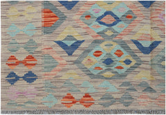 Handwoven Afghan Maimana kilim rug featuring a geometric diamond pattern in multicolored wool.