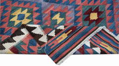 Handwoven Afghan Maimana kilim featuring a geometric pattern in blue, red, and yellow wool.