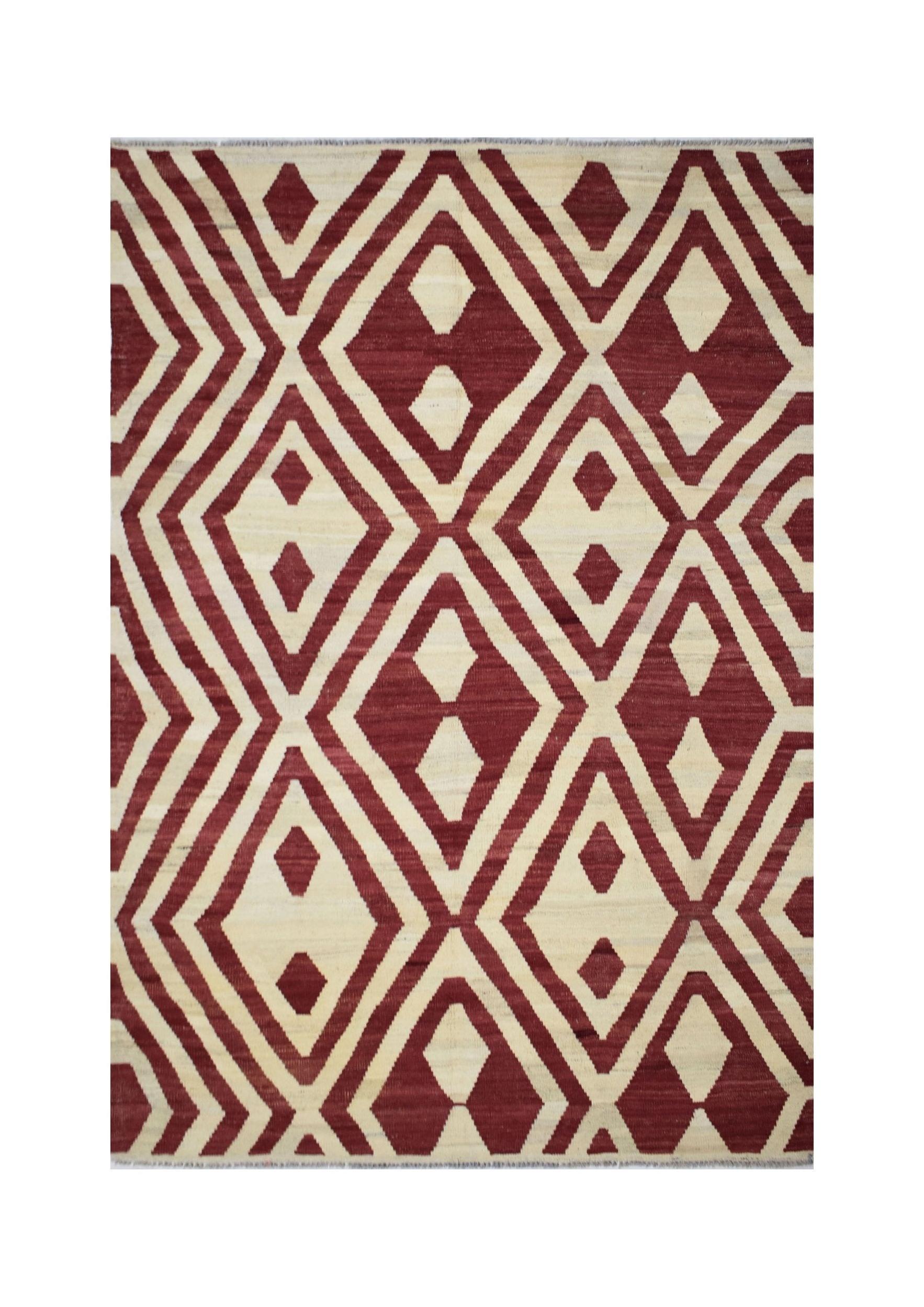 Handmade Afghan Maimana kilim rug featuring a geometric diamond pattern in red and cream wool.