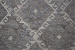 Handwoven Afghan Maiamana kilim featuring a geometric diamond pattern in natural wool tones.