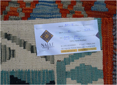 A handwoven Afghan Maimana kilim featuring a geometric pattern in orange, blue, and cream tones.